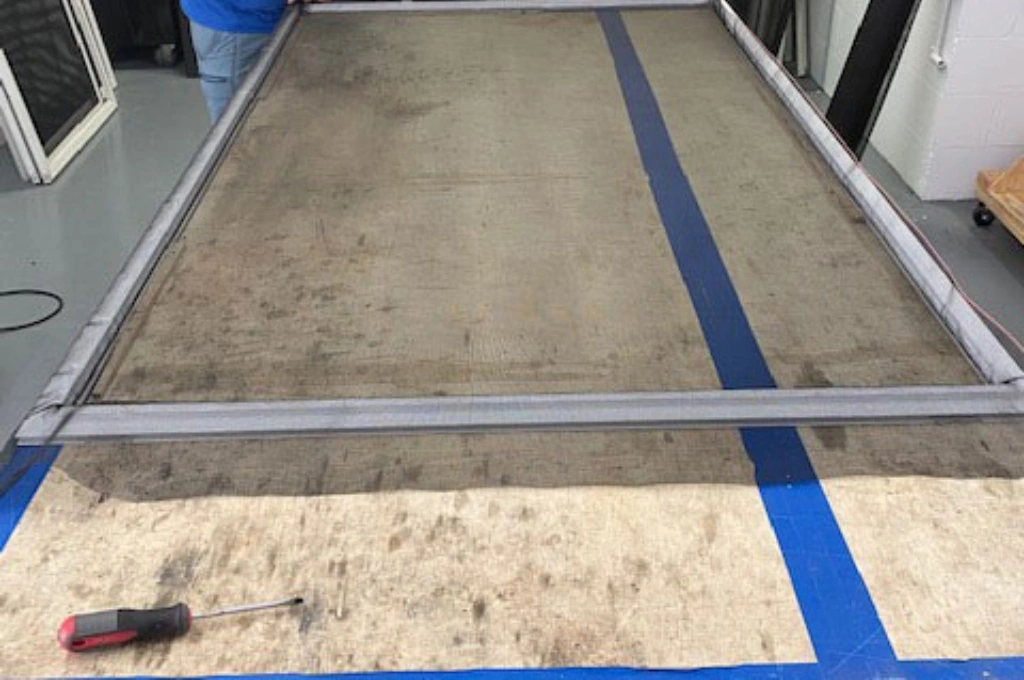 A happy customer in Uptown Dallas after a fast, on-site window screen repair service call.