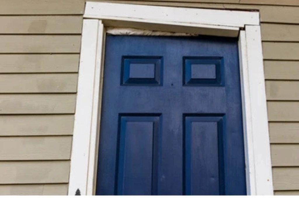 A beautifully restored front door in a Garland, Texas home after a professional frame and latch repair by Windows And Doors Repair LLC, enhancing both security and curb appeal.
