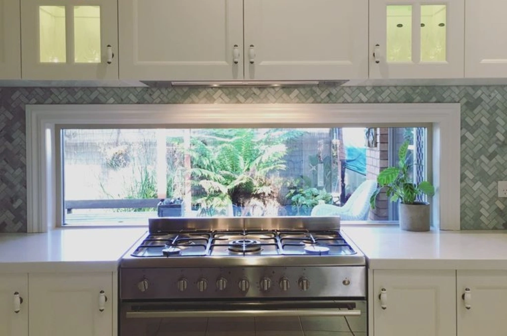 A secure, newly installed kitchen window in a Garland, TX home after a fast and professional emergency glass replacement by Windows And Doors Repair LLC.