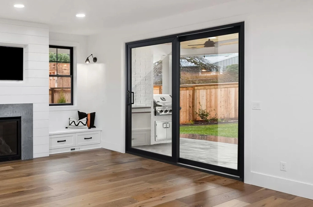 A smoothly gliding sliding glass door in a Plano, TX home after a successful roller and track repair by Windows And Doors Repair LLC.