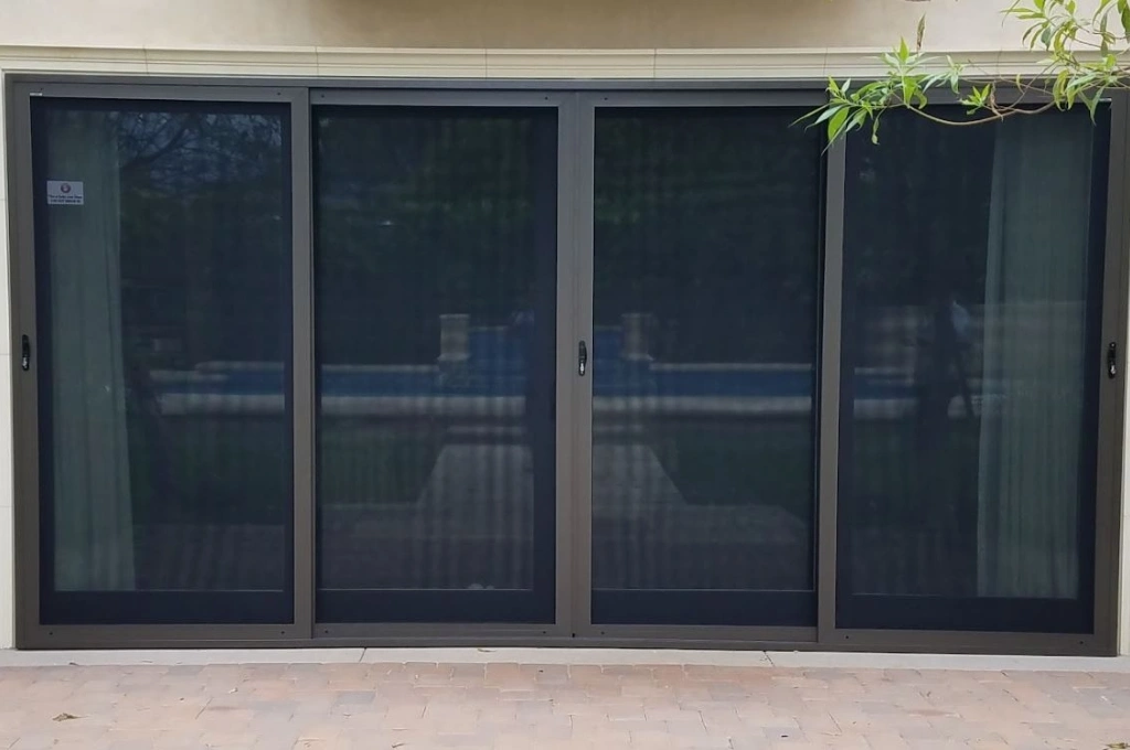 Before and after a professional window screen frame repair in Garland, TX, by the experts at Windows And Doors Repair LLC.