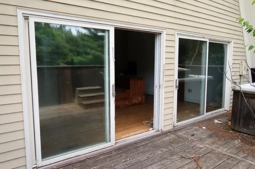 Before and after a professional window seal repair on a patio door in Garland, TX, by Windows And Doors Repair LLC, showing the restored clear view.
