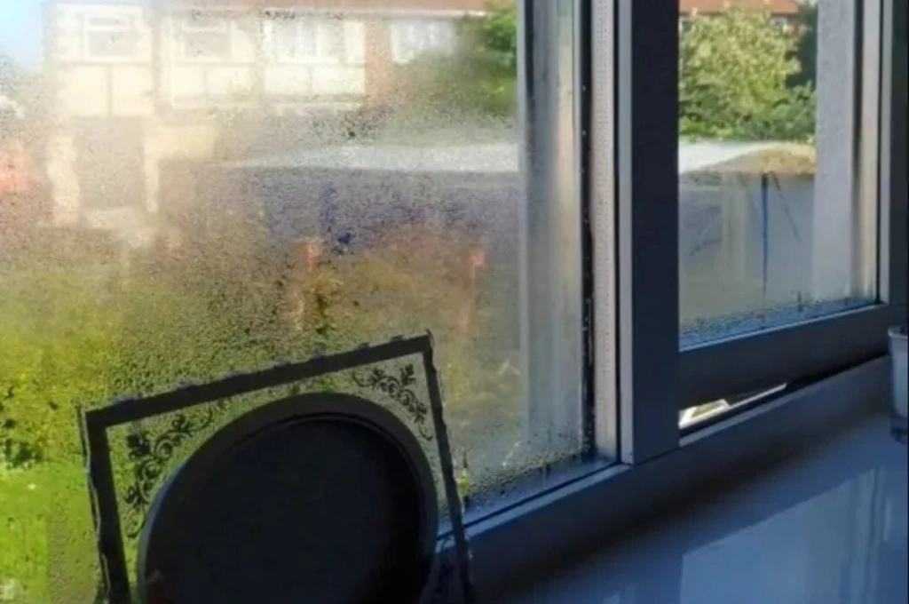 Before and after photo of a double pane window repair in a North Garland home, showing the crystal-clear results from Windows And Doors Repair LLC.