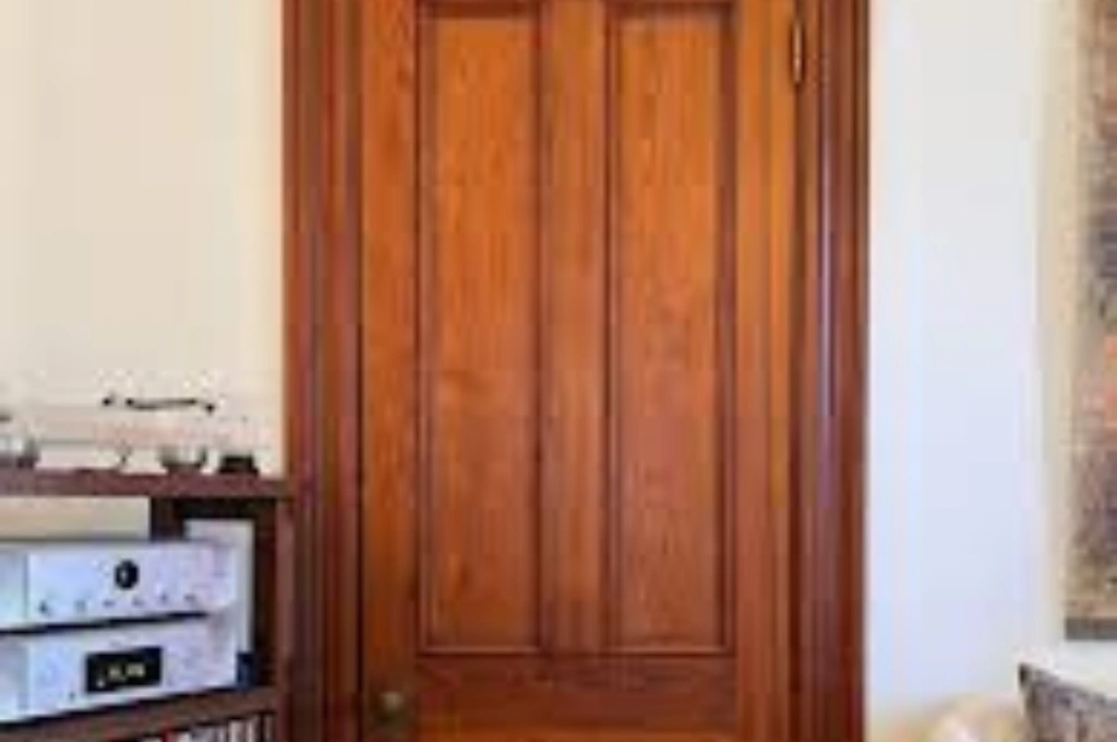 Before and after professional residential door repair on a historic front door in Garland, TX, showcasing restored functionality and security by Windows And Doors Repair LLC.