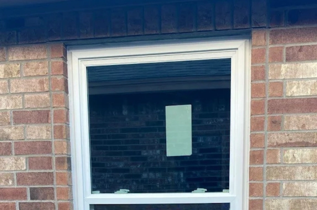 Emergency storm damage window repair in Corpus Christi, TX, showing a secure, newly replaced glass pane installed by Windows And Doors Repair LLC.