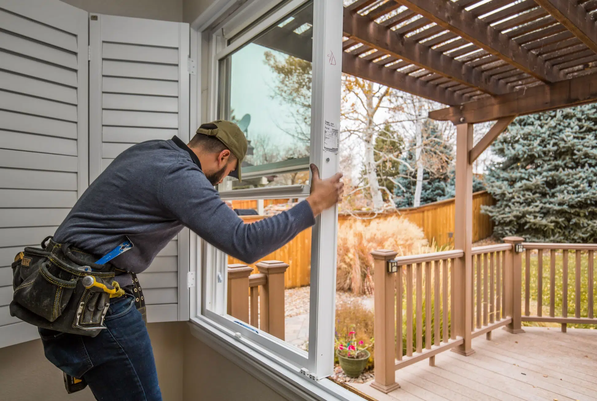 Home window repair diagnostic and glass replacement in Dallas Texas Technician measuring a residential window frame in Dallas before glass unit replacement
