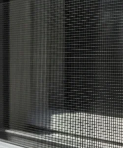 A completed window screen repair San Antonio, showing a flawless, tight finish.