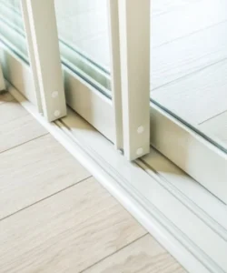 A final shot of the door gliding smoothly with a single finger.