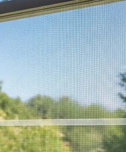 A perfectly installed window screen on an Arlington home, providing a clear view and insect protection.