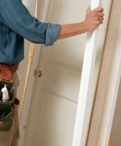A smiling Houston family standing in their doorway, enjoying the comfort of their newly weatherstripped home by Windows And Doors Repair LLC