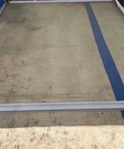 A technician performing a professional window screen repair in Arlington with precision tools.