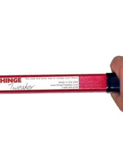 A uniformed technician expertly adjusting a door hinge.