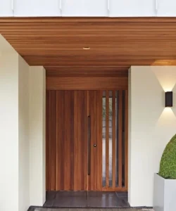 A welcoming residential front door that has been freshly repaired.