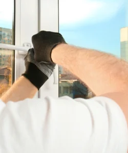 An experienced technician from Windows And Doors Repair LLC performing a detailed window repair inspection in a Fort Worth, TX home.