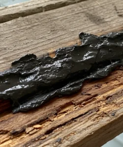 The same window, now perfectly clear, showcasing a crisp view of a Houston landmark.