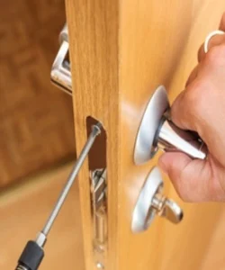 certified technician performing an expert door repair Garland, TX, showcasing the precision of Windows And Doors Repair LLC.