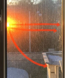 nergy-efficient window demonstration showing heat reflection properties